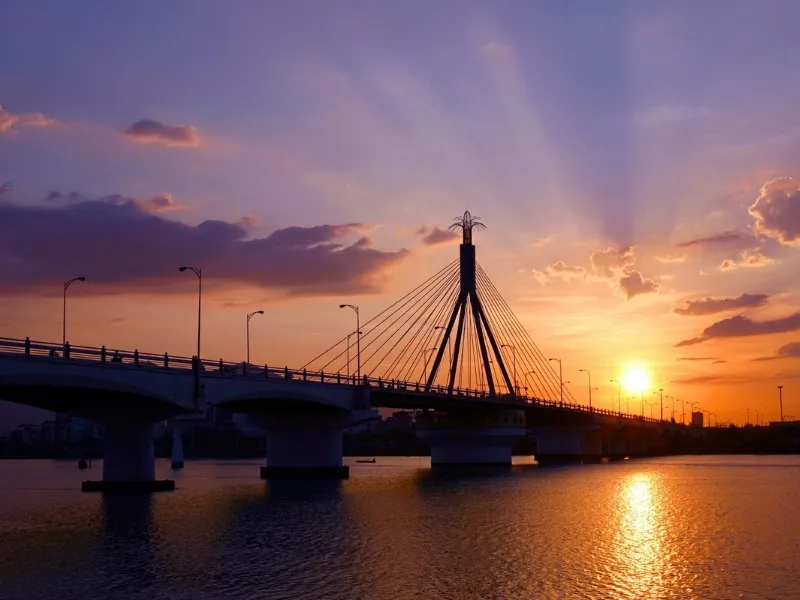 Han River Bridge in Da Nang rotates at night, offering a unique sight as it swings open for passing ships