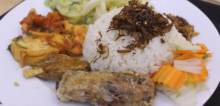 Self-select vegetarian rice portions are a favorite choice for many diners at Tam Duc Vegetarian Rice