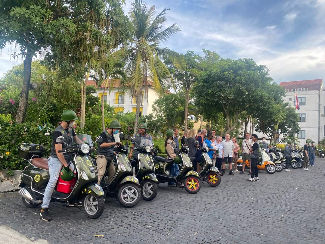 Day tour: Explore the suburban life and culture of Hanoi combined with a visit to Bat Trang pottery village on a military-style Vespa/Minsk motorcycle.